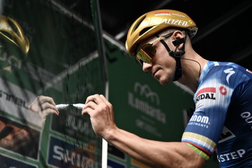 Soudal Quick-Step's Belgian rider Remco Evenepoel signs in, ahead of the 119th edition of the Giro di Lombardia (Tour of Lombardy), a 238km cycling race from Como to Bergamo on October 11, 2025.  Marco BERTORELLO / AFP
