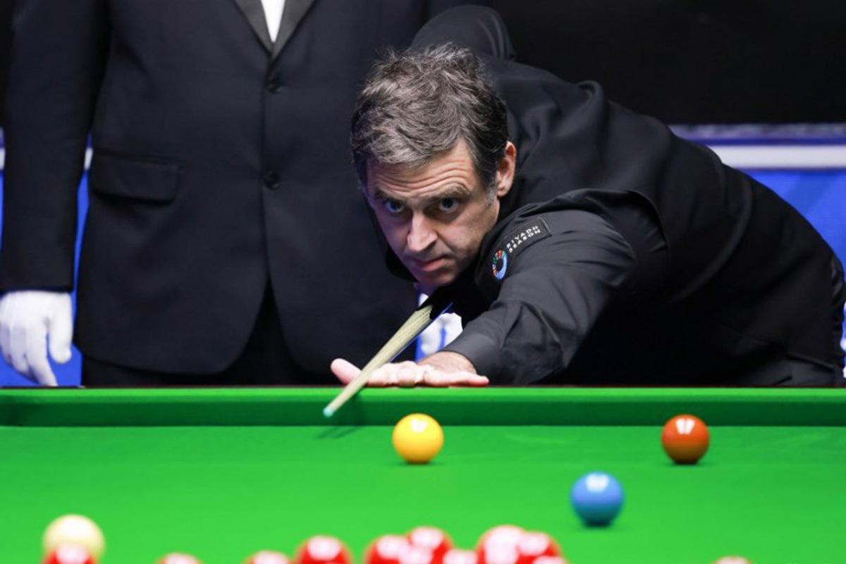 Britain's Ronnie O'Sullivan plays a shot during Frame 1 of his match against Ryan Day of Wales at the Snooker World Open in Yushan, in China's Jiangxi province on March 20, 2026. Seven-time world champion Ronnie O'Sullivan made professional snooker history on March 20 by crafting the highest break ever of 153 at the World Open in China. CN-STR / AFP