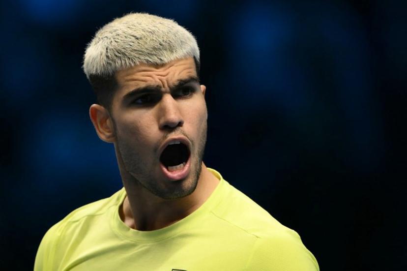Spain's Carlos Alcaraz celebrates after winning his match against Australia's Alex De Minaur at the ATP Finals tennis tournament in Turin on November 9, 2025.  Marco BERTORELLO / AFP