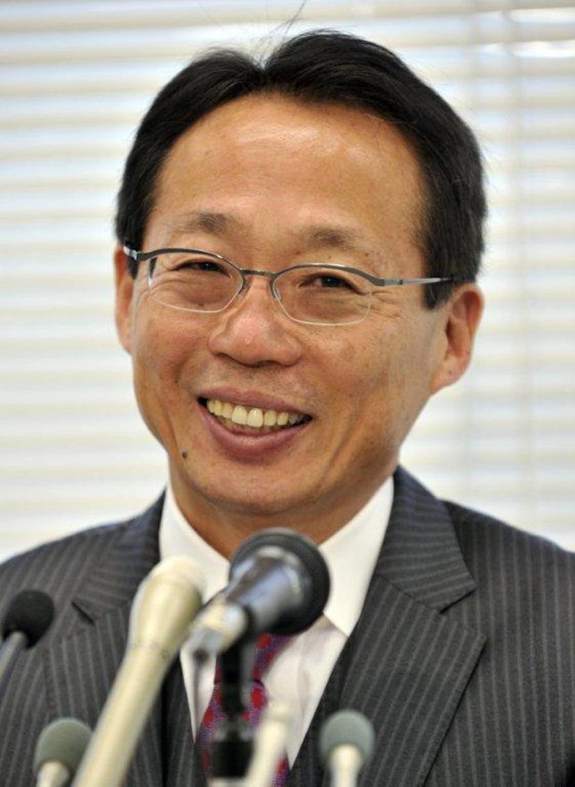 Former Japanese national team head coach Tokeshi Okada smiles as he announces he will join China's Hangzhou Greentown football club during a presser in Tokyo on December 16, 2011. Former Japan coach Takeshi Okada joined China's Hangzhou Greentown December 15, further bolstering the Super League's ranks just days after the landmark signing of French star Nicolas Anelka. AFP PHOTO / Yoshikazu TSUNO  YOSHIKAZU TSUNO / AFP