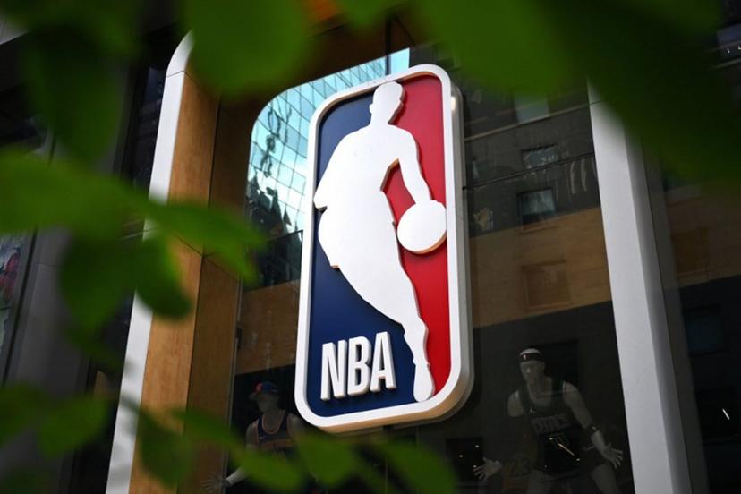 The NBA logo is seen outside an NBA fan store in New York on July 8, 2024.  ANGELA WEISS / AFP