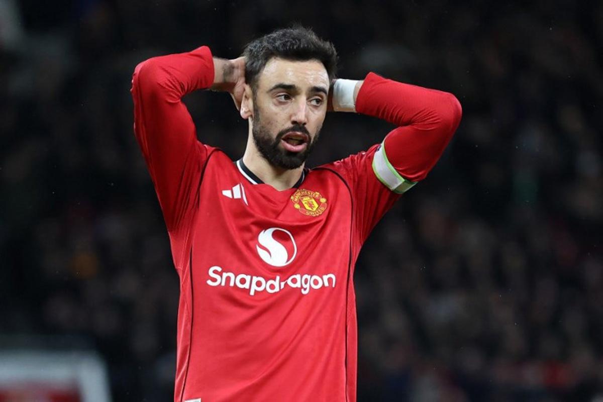 Manchester United's Portuguese midfielder #08 Bruno Fernandes reacts to a missed chance during the English Premier League football match between Manchester United and Everton at Old Trafford in Manchester, north west England, on November 24, 2025.  Darren Staples / AFP