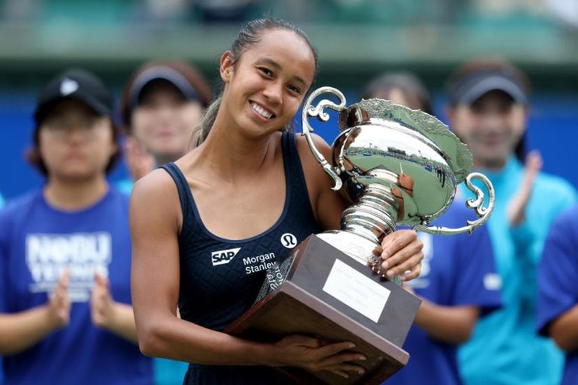 Canada's Leylah Fernandez poses with the winner's trophy after defeating Czech Republic's Tereza Valentova in their women's singles final match at the Japan Open tennis tournament in Osaka on October 19, 2025.  PAUL MILLER / AFP