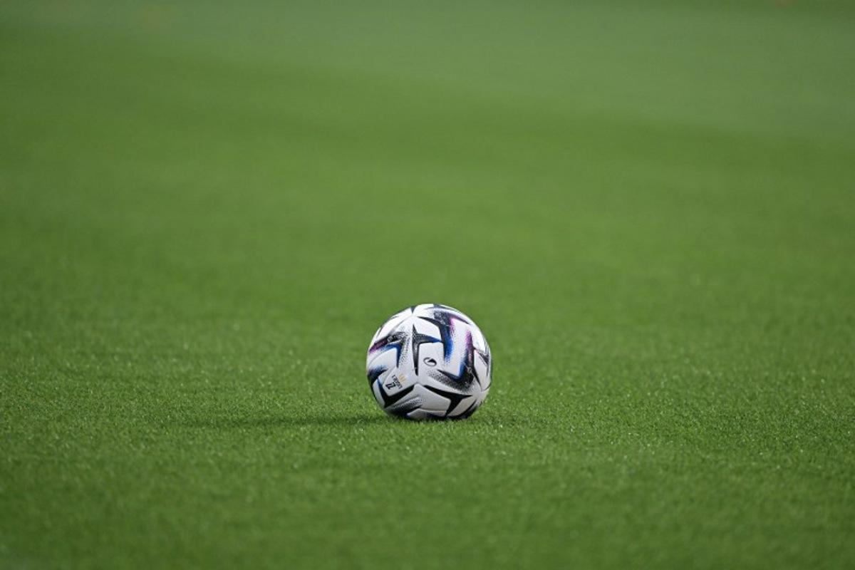 This photograph shows the the Ligue 1 ball on the pitch prior to the start of the French L1 football match between Stade Rennais FC and Olympique Lyonnais (OL) at the Roazhon Park stadium in Rennes, western France, on September 14, 2025.   DAMIEN MEYER / AFP