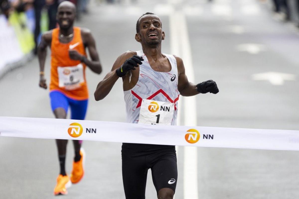 Bashir Abdi from Belgium crosses the finish line to win the Rotterdam Marathon in Rotterdam, on April 16, 2023.  Sem van der Wal / ANP / AFP
