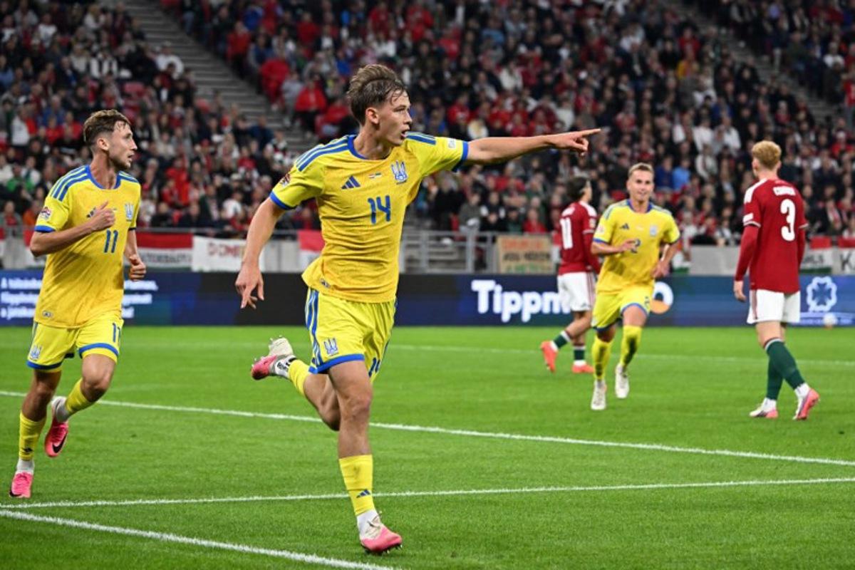 Ukraine's forward Danylo Sikan (2L) celebrates scoring his team's first goal during the UEFA Nations League Group B2 football match between Hungary and Ukraine in Budapest, Hungary on September 25, 2026.  Attila KISBENEDEK / AFP
