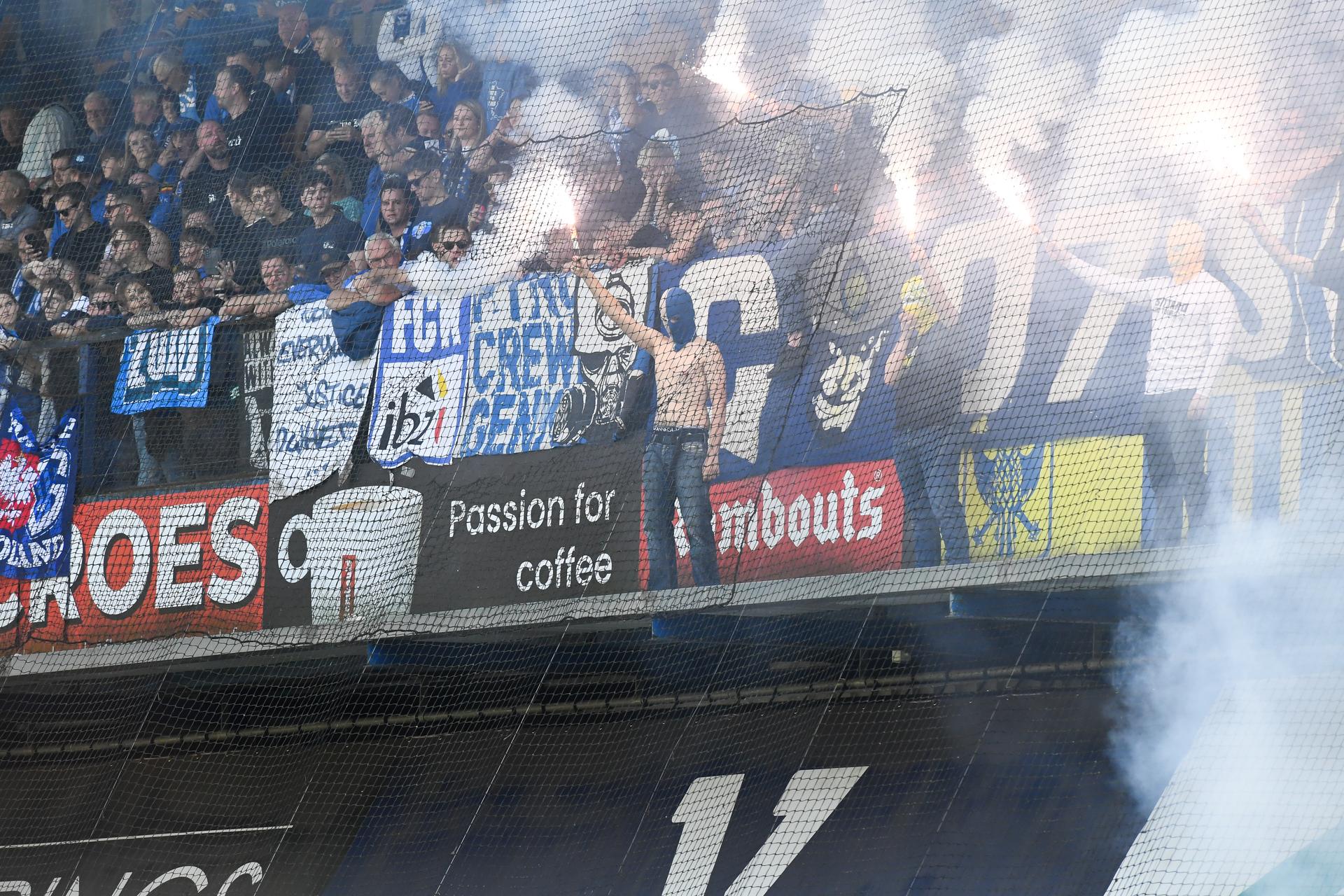 Supporters with fireworks and smoke bombs pictured during a soccer match between Sint-Truidense V.V. and KRC Genk, Sunday 28 September 2025 in Sint-Truiden, on day 9 of the 2025-2026 'Jupiler Pro League' first division of the Belgian championship. BELGA PHOTO JILL DELSAUX