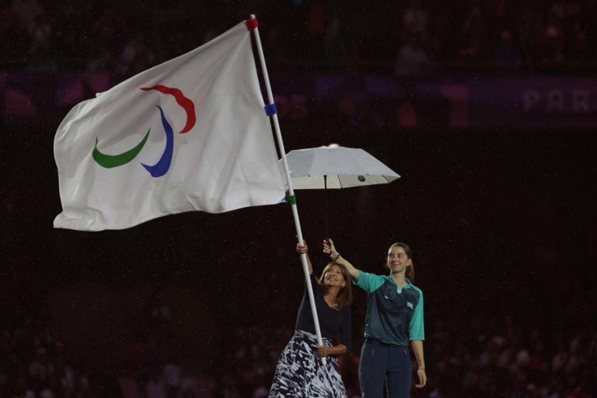 Mayor of Paris Anne Hidalgo waves the Paralympics flag during the Paris 2024 Paralympic Games Closing Ceremony at the Stade de France, in Saint-Denis, in the outskirts of Paris, on September 8, 2024.  Thibaud Moritz / AFP