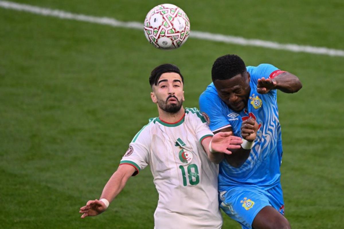 Algeria's forward #18 Mohamed Amoura and Democratic Republic Of Congo's defender #22 Chancel Mbemba jump for the ball during the Africa Cup of Nations (CAN) round of 16 football match between Algeria and Democratic Republic of Congo at the Prince Moulay El Hassan Stadium in Rabat on January 6, 2026.   SEBASTIEN BOZON / AFP