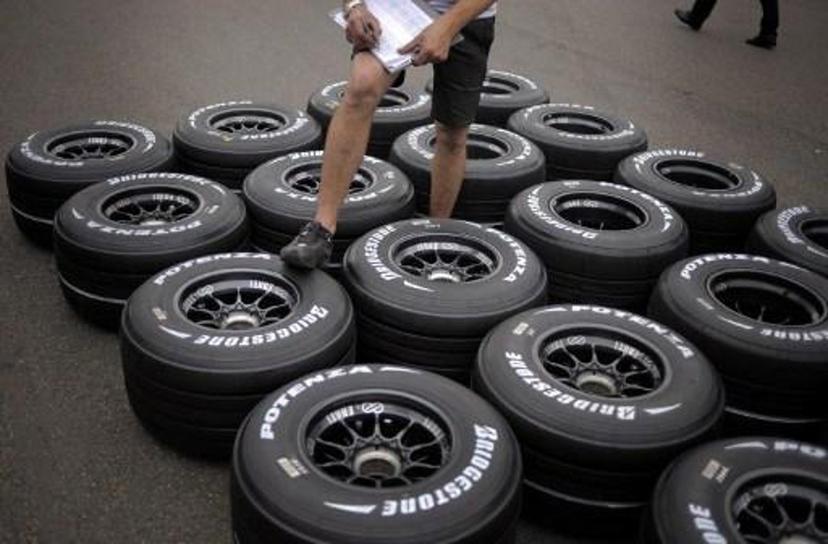 A technician cheks tires in the paddock of the Magny-Cours racetrack on June 19, 2008 in Magny-Cours, central France, three days ahead of the French Formula One Grand Prix.       AFP PHOTO / JEFF PACHOUD