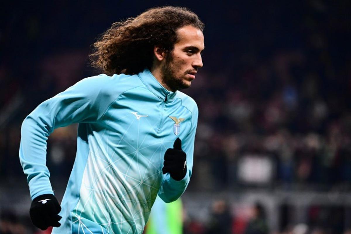 Lazio's French midfielder #8 Matteo Guendouzi warms up before the start of the Italian Serie A football match between AC Milan and Lazio at the San Siro Stadium in Milan, Italy on November 29, 2025.  Piero CRUCIATTI / AFP