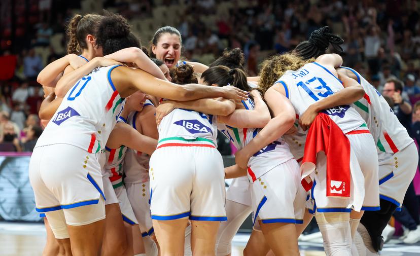 Italy's players celebrate after winning a basketball match between Italy and Turkey, in the quarterfinals of the FIBA Women's EuroBasket tournament, Tuesday 24 June 2025 in Piraeus, Greece. BELGA PHOTO VIRGINIE LEFOUR