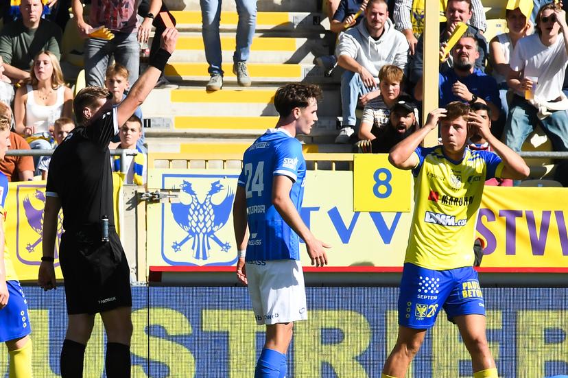 STVV's Rein Van Helden receives a red card from, referee Lawrence Visser and during a soccer match between Sint-Truidense V.V. and KRC Genk, Sunday 28 September 2025 in Sint-Truiden, on day 9 of the 2025-2026 'Jupiler Pro League' first division of the Belgian championship. BELGA PHOTO JILL DELSAUX