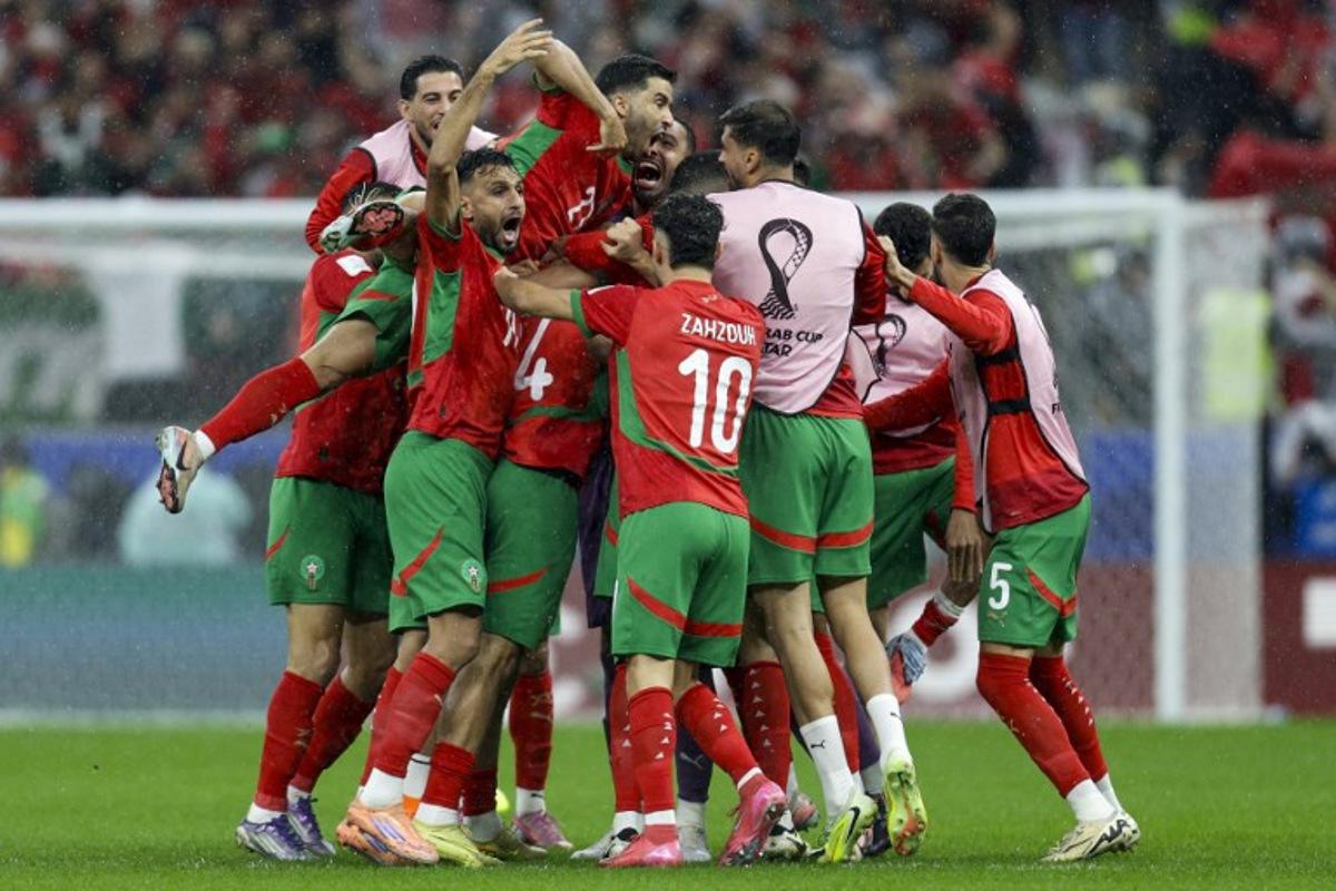 Morocco's players celebrate their team's first goal during the FIFA Arab Cup 2025 final football match between Jordan and Morocco at the Lusail Stadium Stadium, in Lusail on December 18, 2025.  Karim JAAFAR / AFP