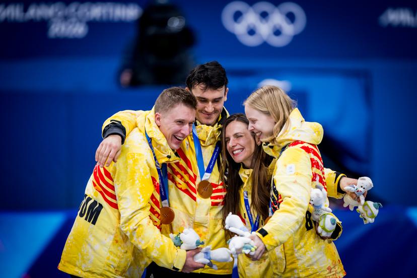 Belgian shorttrack skater Tineke den Dulk, Belgian shorttrack skater Ward Petre, Belgian shorttrack skater Hanne Desmet and Belgian shorttrack skater Stijn Desmet celebrate after winning the bronze medal during the finals of the Mixed Team Relay of the Short Track Speed Skating competition at the Milano Cortina 2026 Olympic Winter Games, on Tuesday 10 February 2026 in Milan, Italy. The XXV Winter Olympics take place from 6 to 22 February 2026 in Italy. BELGA PHOTO JASPER JACOBS