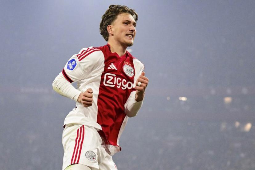 Ajax's Belgian forward #11 Mika Godts celebrates scoring the opening goal during the Dutch Eredivisie first division football match between AFC Ajax and SC Heerenveen at the Johan Cruijff ArenA in Amsterdam on November 1, 2025.  Olaf KRAAK / ANP / AFP