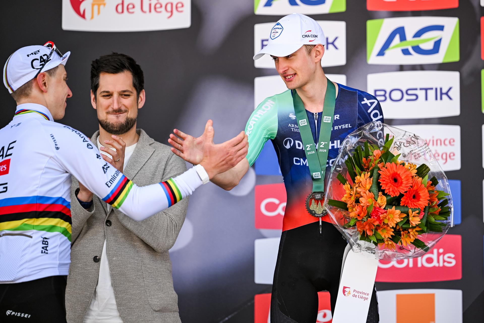 Slovenian Tadej Pogacar of UAE Team Emirates-XRG and French Paul Seixas of Decathlon CMA CGM Team pictured on the podium after the men elite race of the Liege-Bastogne-Liege UCI World Tour one day cycling race, 259,5km from Liege, over Bastogne to Liege, Sunday 26 April 2026. BELGA PHOTO MAARTEN STRAETEMANS