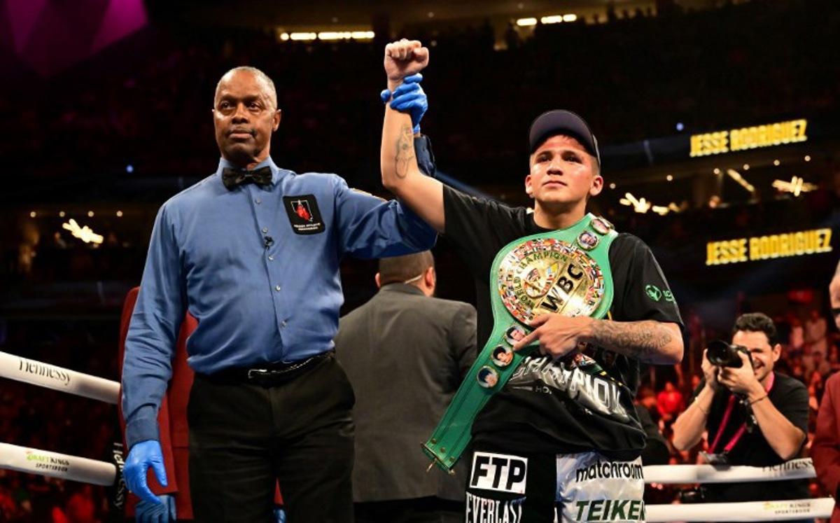 US boxer Jesse Rodriguez celebrates with his belt after defeating Mexican boxer Israel Gonzalez during their World Boxing Council (WBC) super flyweight title bout at the T-Mobile Arena in Las Vegas, Nevada, September 17, 2022.   Frederic J. BROWN / AFP