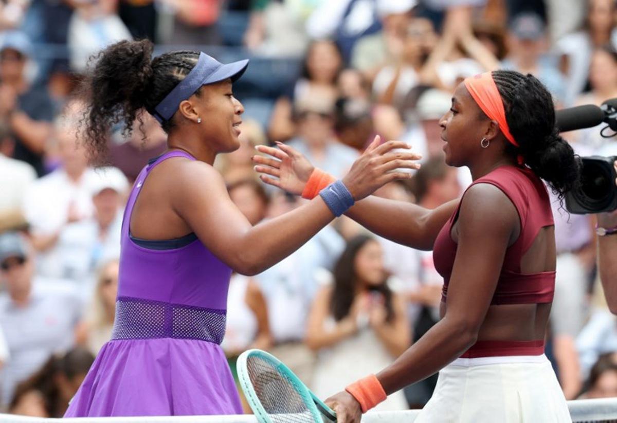 Japan's Naomi Osaka (L) and USA's Coco Gauff hug at te net after Osaka's victory during their women's singles round of 16 tennis match on day nine of the US Open tennis tournament at the USTA Billie Jean King National Tennis Center in New York City, on September 1, 2025.  TIMOTHY A.CLARY / AFP