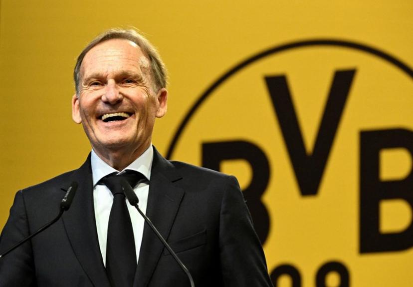 Borussia Dortmund's CEO Hans-Joachim Watzke delivers a speech during the German first division Bundesliga football club's annual general meeting in Dortmund, western Germany on November 23, 2025.  After 20 years as managing director, Watzke aims to be elected as president of the club to replace current president Reinhold Lunow. Ina FASSBENDER / AFP