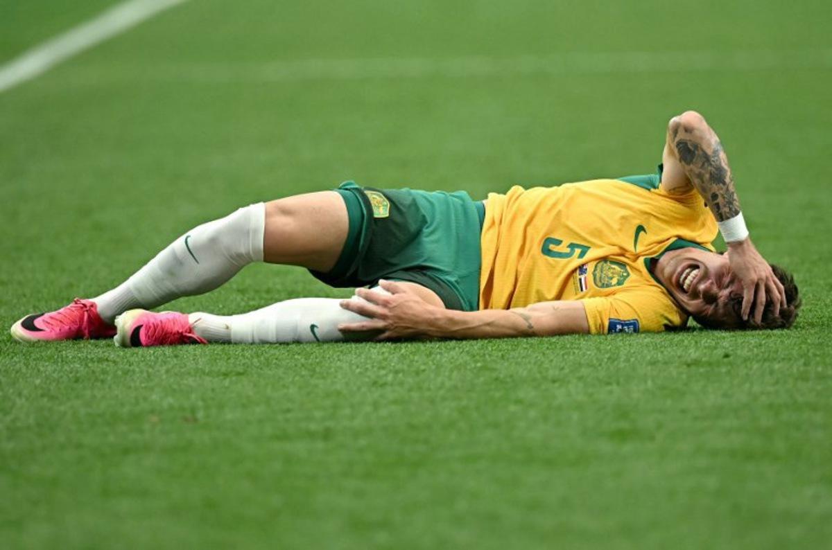Australia's defender #05 Jordan Bos reacts on the ground during the 2026 World Cup round of 32 football match between Australia and Egypt at the Dallas Stadium in Arlington on July 3, 2026.   Paul ELLIS / AFP