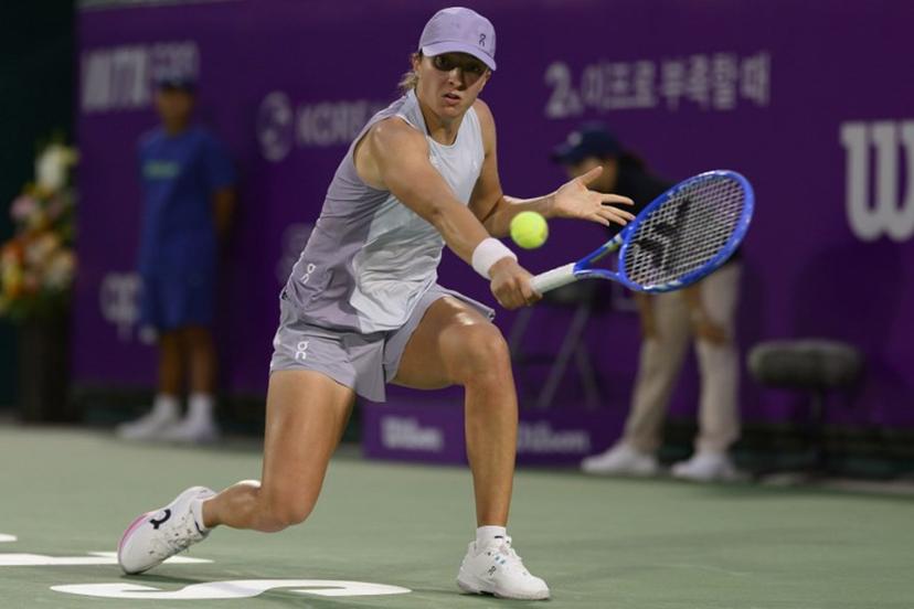 Iga Swiatek of Poland hits a return to Maya Joint of Australia during their women's singles semi-final match at the Korea Open tennis tournament in Seoul on September 20, 2025.  ANTHONY WALLACE / AFP