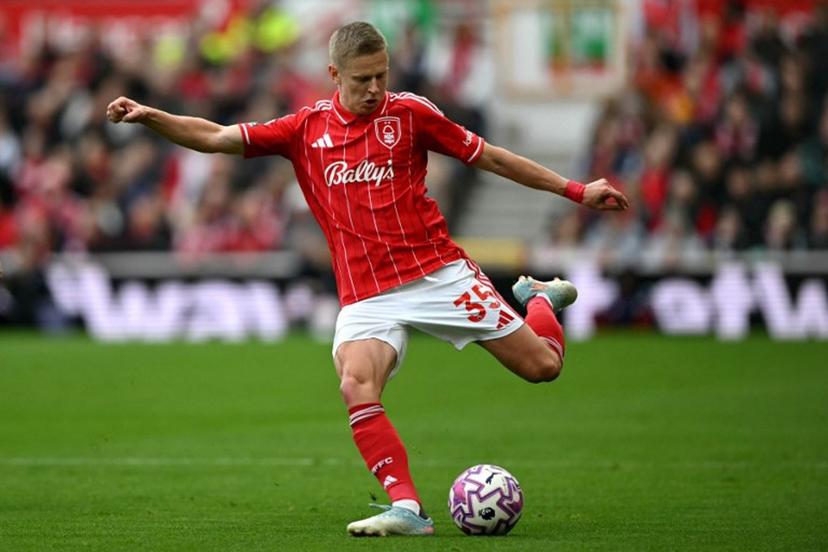 Nottingham Forest's Ukrainian defender #35 Oleksandr Zinchenko crosses the ball during the English Premier League football match between Nottingham Forest and Chelsea  at The City Ground in Nottingham, central England, on October 18, 2025.  JUSTIN TALLIS / AFP