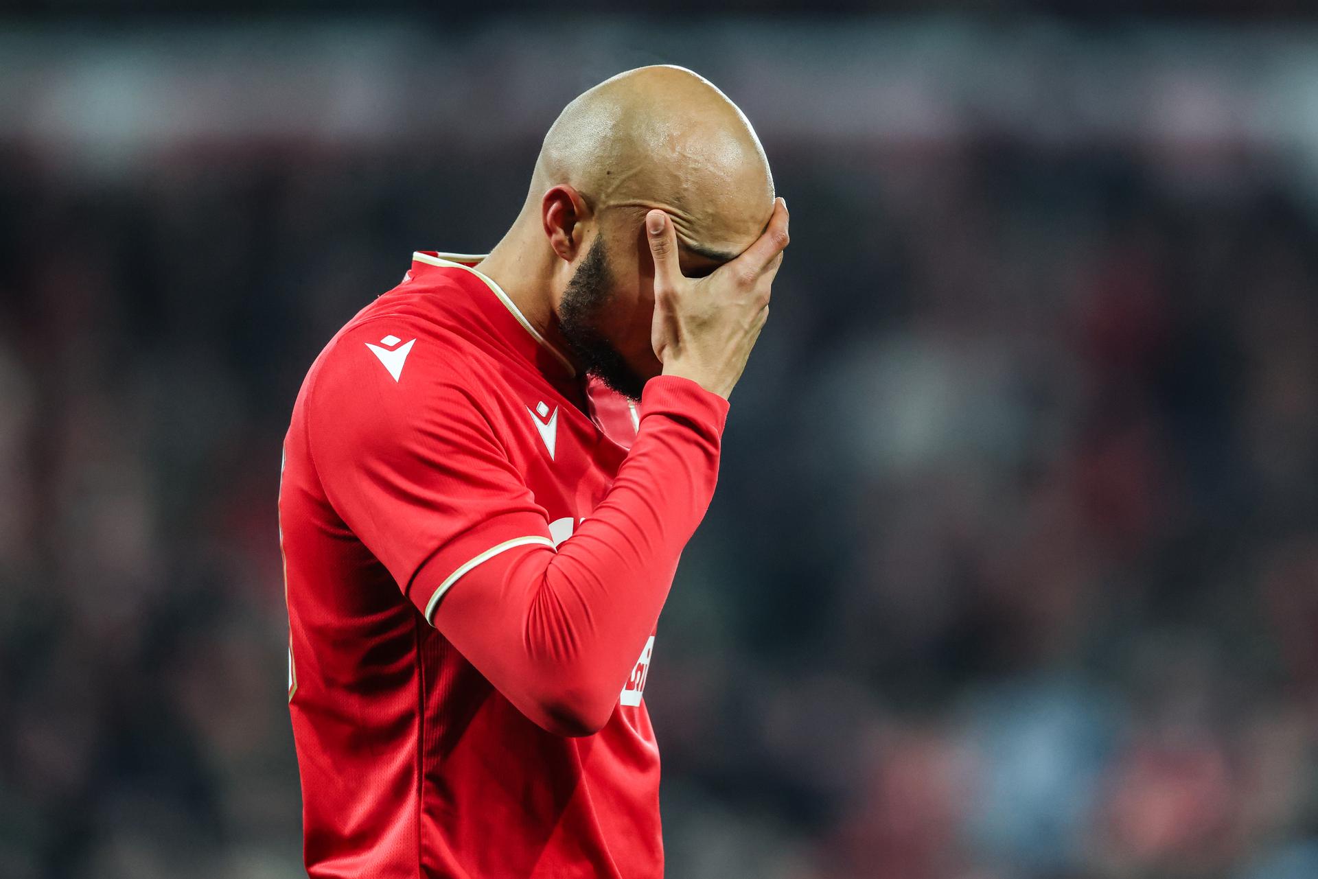 Standard's Timothe Nkada leaves the field after receiving a red card during a soccer match between Standard de Liege and Sint-Truiden VV, Friday 26 December 2025 in Liege, on day 20 of the 2025-2026 'Jupiler Pro League' first division of the Belgian championship. BELGA PHOTO BRUNO FAHY