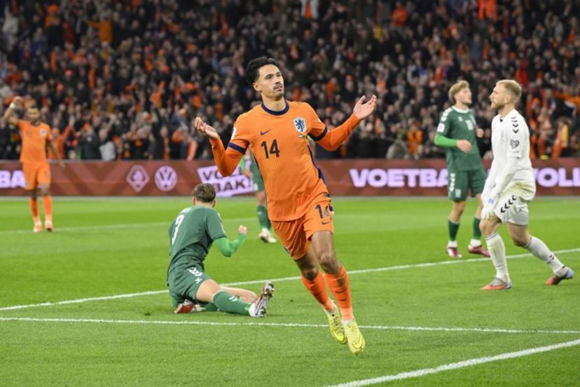 Netherlands' midfielder #14 Tijjani Reijnders (C) celebrates after scoring the Netherlands first goal during the FIFA World Cup 2026 Group G European qualification football match between the Netherlands and Lithuania at the Johan Cruijff Arena, in Amsterdam, on November 17, 2025.  JOHN THYS / AFP