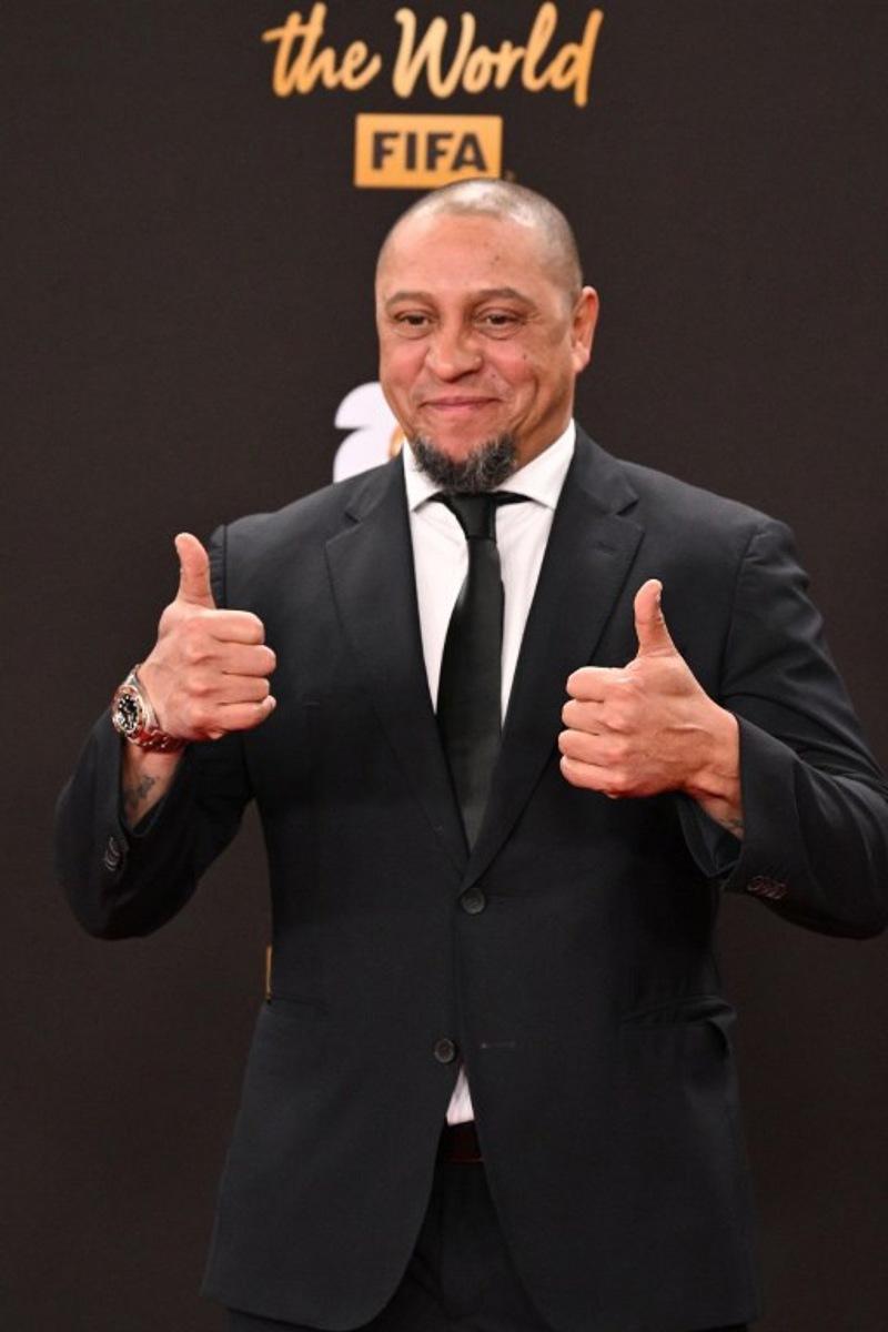 Former Brazilian player Roberto Carlos poses on the red carpet upon arrival to attend the draw for the 2026 FIFA Football World Cup taking place in the US, Canada and Mexico, at the Kennedy Center, in Washington, DC, on December 5, 2025.  Roberto SCHMIDT / AFP