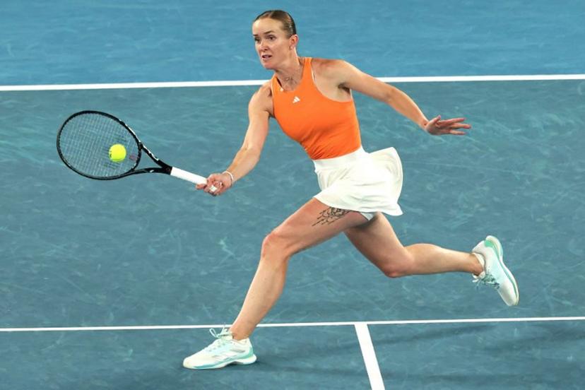 Ukraine's Elina Svitolina hits a return to USA's Coco Gauff during their women's singles quarter-final match on day ten of the Australian Open tennis tournament in Melbourne on January 27, 2026.  DAVID GRAY / AFP