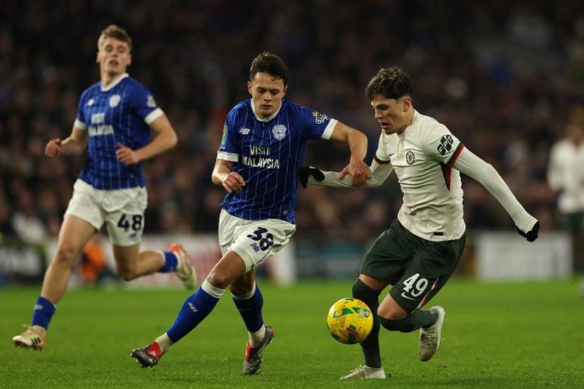 Chelsea's Argentinian midfielder #19 Alejandro Garnacho (R) vies with Cardiff City's English defender #38 Perry Ng (C) during the English League Cup quarter-final football match between Cardiff City and Chelsea at Cardiff City Stadium, in Cardiff, south Wales on December 16, 2025.  Adrian Dennis / AFP