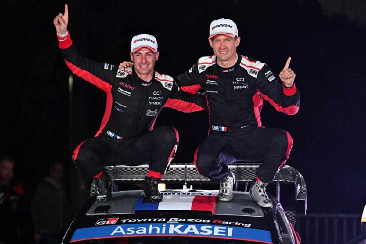 Sebastien Ogier (R) and his co-driver Vincent Landais (L) of France celebrate their victory on their Toyota GR Yaris Rally1 during the podium ceremony of the Rally Japan, the 13th round of the FIA World Rally Championships, in Toyota city, Aichi prefecture on November 9, 2025.  Toshifumi KITAMURA / AFP