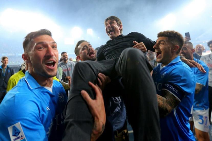 Napoli's Italian coach Antonio Conte is thrown in the air by his players as they celebrate after winning Italian Serie A football match between Napoli and Cagliari at the Diego Armando Maradona stadium in Naples on May 23, 2025.  Carlo Hermann / AFP