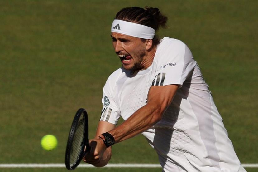 Germany's Alexander Zverev returns to Italy's Jannik Sinner during their men's singles final tennis match on the fourteenth day of the 2026 Wimbledon Championships at The All England Lawn Tennis and Croquet Club in Wimbledon, southwest London, on July 12, 2026.  Adrian Dennis / AFP