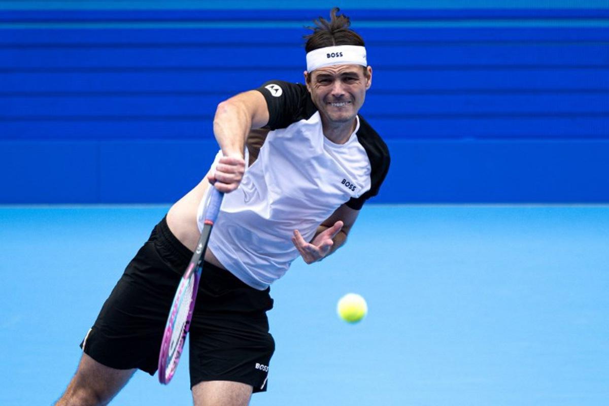 USA's Taylor Fritz serves against USA's Sebastian Korda during their men's singles match at the ATP Japan Open tennis tournament in Tokyo on September 28, 2025.  Philip FONG / AFP