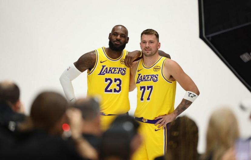 US basketball player LeBron James (L) and Slovenian basketball player Luka Doncic (R) pose for photos during the Los Angeles Lakers media day at UCLA Health Training Center El Segundo, California on September 29, 2025.  Patrick T. Fallon / AFP