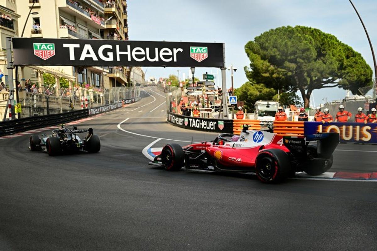Mercedes' Italian driver Kimi Antonelli (L) leads the standing start followed by Ferrari's British driver Lewis Hamilton (R) during Monaco Formula 1 Grand Prix at the Monaco street circuit in Monaco, ahead of the, on June 7, 2026.   Andrej ISAKOVIC / AFP