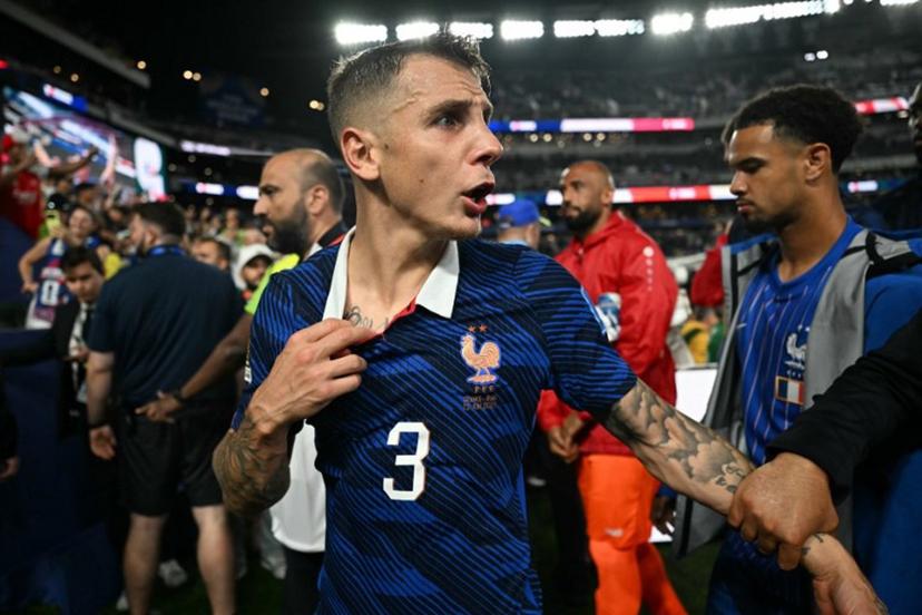 France's defender #03 Lucas Digne gestures as he leaves the pitch after winning the 2026 World Cup Group I football match between France and Iraq at the Philadelphia Stadium in Philadelphia on June 22, 2026.   MAURO PIMENTEL / AFP