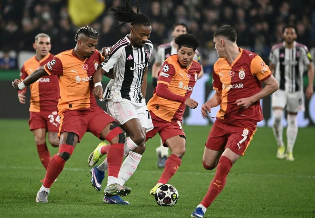 Juventus' French midfielder #19 Khephren Thuram (2nd L) fights for the ball with Galatasaray's Gabonese midfielder #99 Mario Lemina (L), Brazilian midfielder #8 Gabriel Gomez Sara (2nd R) and Hungarian forward #7 Rolanad Sallai (R) during the UEFA Champions League, knockout round play-off second leg, football match between Juventus FC and Galatasaray SK at the Allianz stadium in Turin, on February 25, 2026.  Isabella BONOTTO / AFP