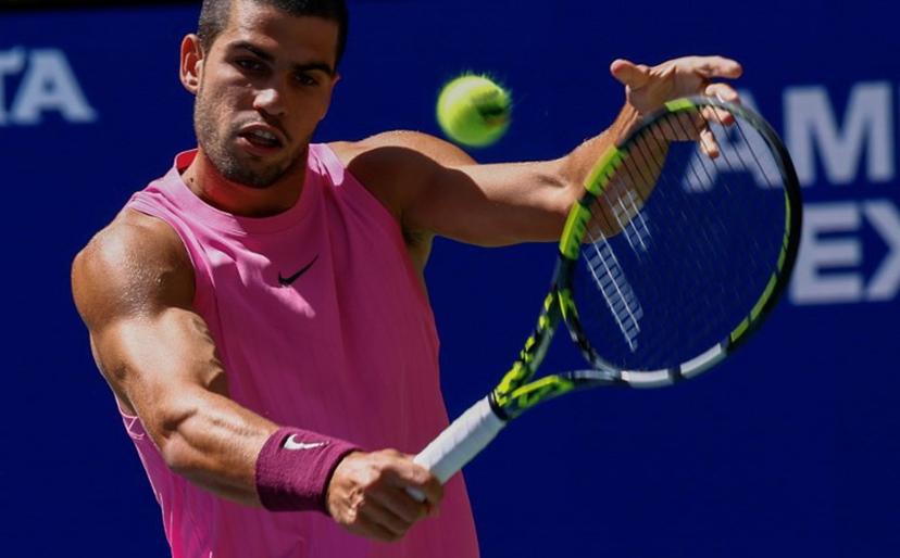 Spain's Carlos Alcaraz plays a backhand return to Czech Republic's Jiri Lehecka during their men's singles quarterfinal tennis match on day ten of the US Open tennis tournament at the USTA Billie Jean King National Tennis Center in New York City, on September 2, 2025.  Kena Betancur / AFP