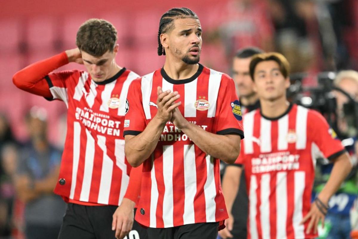 PSV Eindhoven's Curacaoan defender #04 Armando Obispo (C) reacts after a draw in the  UEFA Champions League - League phase, Matchday 1 - football match between PSV Eindhoven and FC Shakhtar Donetsk at the Philips Stadium in Eindhoven on September 10, 2026.  NICOLAS TUCAT / AFP