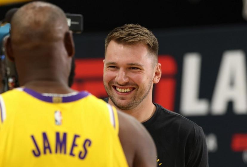 US basketball player LeBron James (L) and Slovenian basketball player Luka Doncic (R) attend the Los Angeles Lakers media day at UCLA Health Training Center El Segundo, California on September 29, 2025.  Patrick T. Fallon / AFP