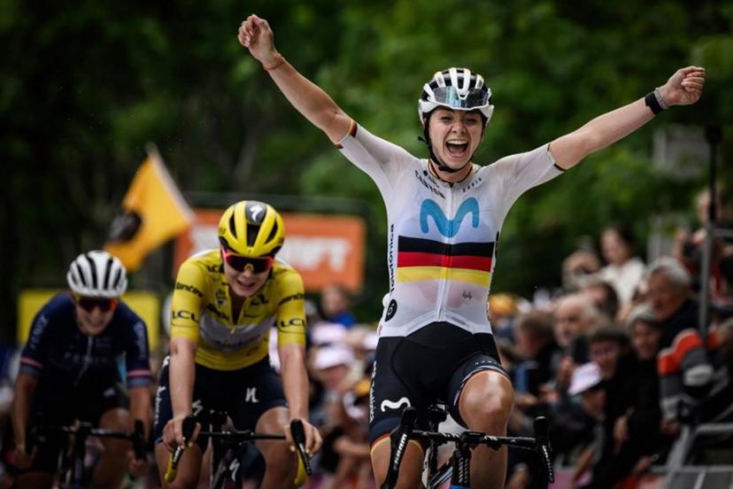 Movistar's German rider Liane Lippert (R), flanked by stage's 2nd placed, Yellow jersey of overall leader, SD Worx' Belgian rider Lotte Kopecky (C), crosses the finish line as she wins the second stage (out of 8) of the second edition of the Women's Tour de France cycling race 151 km between Clermont-Ferrand and Mauriac, in the Auvergne-Rhone-Alpes region, south-eastern France, on July 24, 2023.  Jeff PACHOUD / AFP