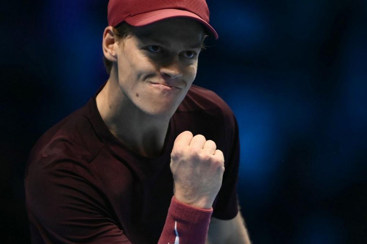 Italy's Jannik Sinner reacts during his match against Canada's Felix Auger-Aliassime at the ATP Finals tennis tournament in Turin on November 10, 2025.  Marco BERTORELLO / AFP