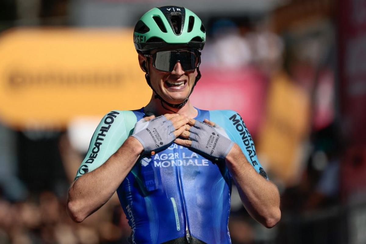 Decathlon AG2R La Mondiale Team's French rider Nicolas Prodhomme reacts after victory as he crosses the finish line of the 19th stage of the 108th Giro d'Italia cycling race of 166kms from Biella to Champoluc on May 30, 2025.  Luca Bettini / AFP