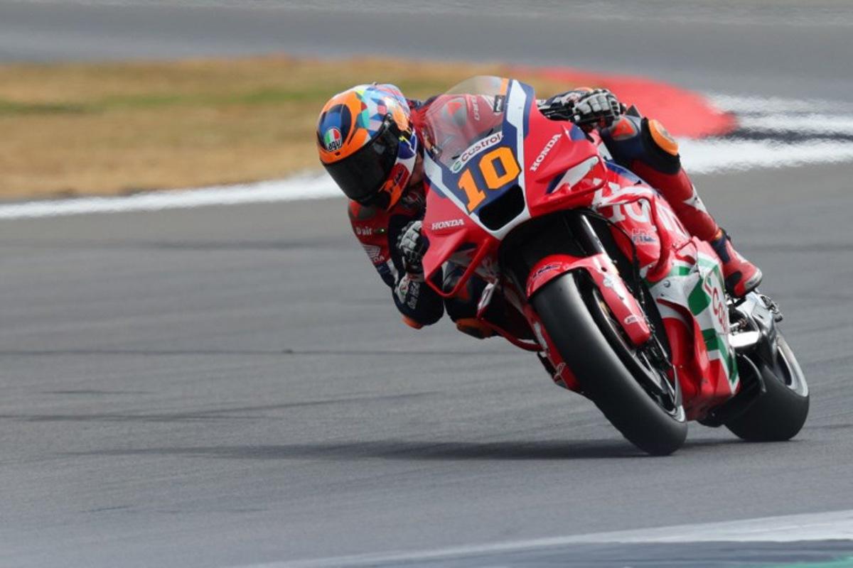 Honda HRC Castrol team's  Italian MotoGP rider Luca Marini takes part in the sprint race of the MotoGP British Grand Prix at Silverstone circuit in Northamptonshire, central England, on May 24, 2025.   Adrian Dennis / AFP