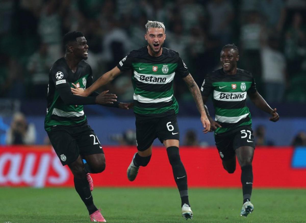 Sporting Lisbon's Belgian defender #06 Zeno Debast celebrates with Sporting Lisbon's Ivorian defender #26 Ousmane Diomande and Sporting Lisbon's Portuguese forward #57 Geovany Quenda scoring his team's second goal during the UEFA Champions League 1st round day 1 football match between Sporting CP and LOSC Lille, at Alvalade stadium in Lisbon, on September 17, 2024.  CARLOS COSTA / AFP