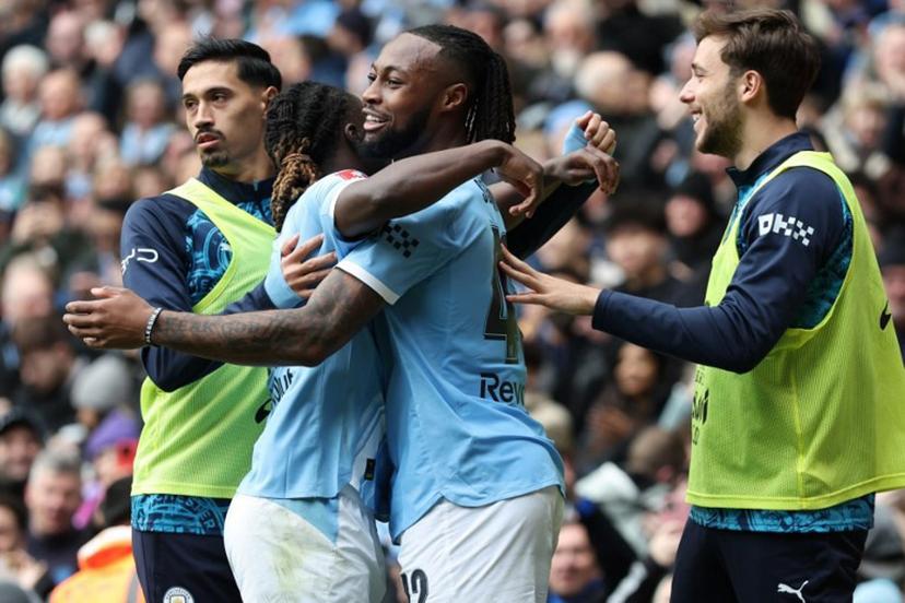 Manchester City's Ghanaian midfielder #42 Antoine Semenyo (C) celebrates with teammates after scoring their third goal during the English FA Cup quarter final football match between Manchester City and Liverpool at the Etihad Stadium in Manchester, north west England, on April 4, 2026.  Darren Staples / AFP