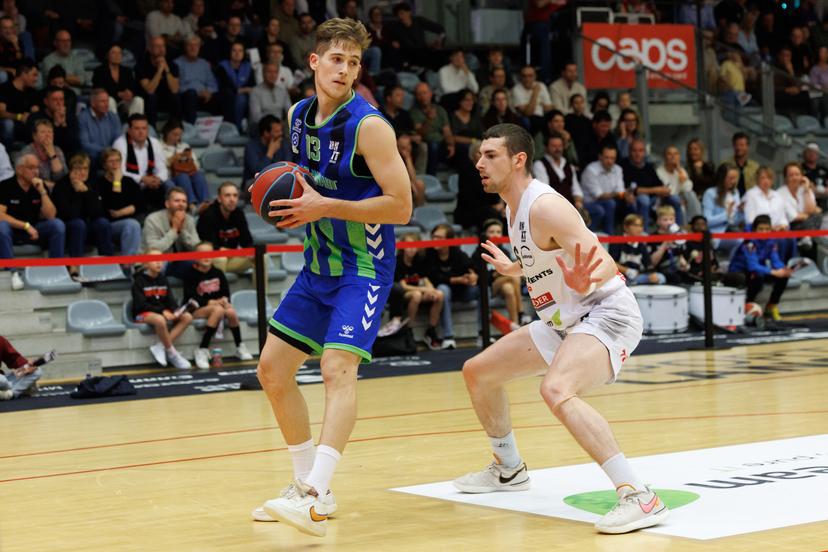 Mons' Maks Klanjscek and Kortrijk's Jame Lessuisse fight for the ball during a basketball match between House of Talents Spurs Kortrijk and Mons-Hainaut, Friday 10 October 2025 in Kortrijk, on day 3 of the 'BNXT League' first division basket championship. BELGA PHOTO KURT DESPLENTER